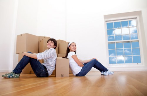 Professional movers handling a delivery with caution
