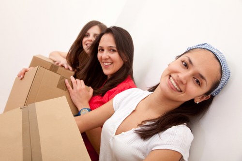 Commercial movers handling office equipment carefully
