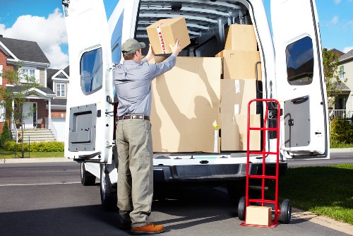 Removal team carrying furniture through a residential property
