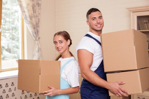 Packed moving boxes and furniture ready for local house removals