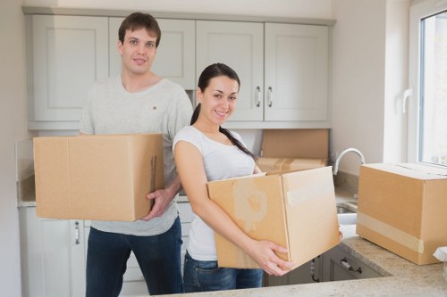 Boxes, office furniture, and equipment prepared for a business move